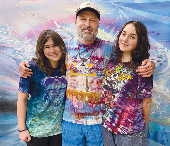 Gallery owner and his two daughters